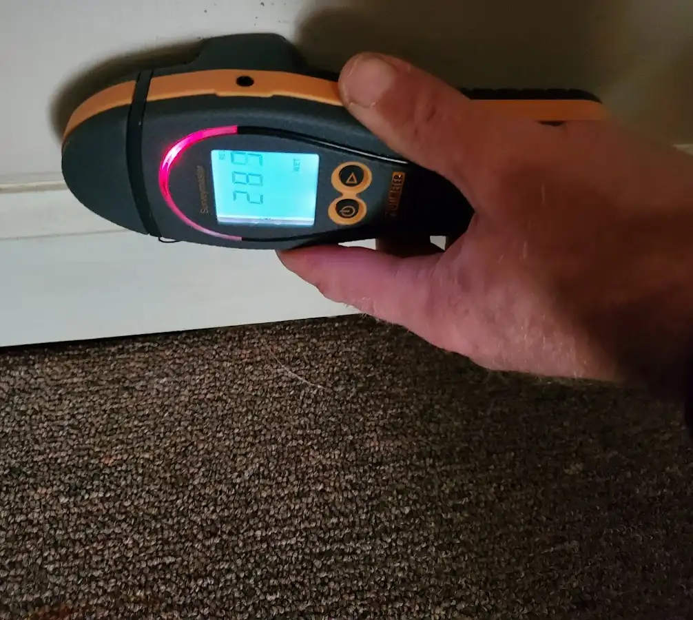 Moisture detection at baseboard during Storm Damage Restoration in Walkertown